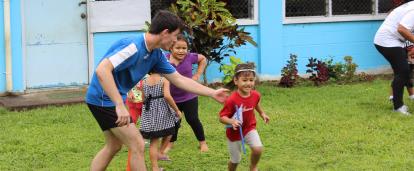 Volunteer teaches children rugby exercises on the Samoa Sports Coaching Project Projects Abroad volunteer teaches children rugby exercises on the Samoa Sports Coaching Project